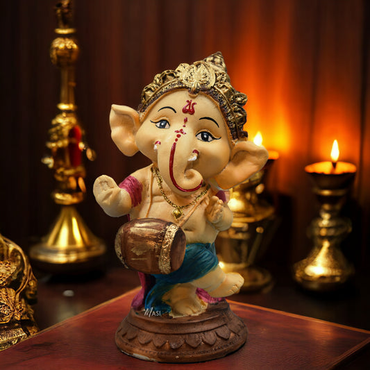 Lord Ganesha Idol Playing Dholak Decorative Showpiece