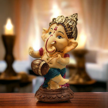 Lord Ganesha Idol Playing Dholak Decorative Showpiece