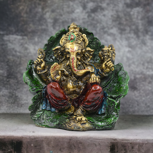 Lord Ganesh Ji Sitting On Leaf Murti (17 Cm Height)